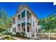 Charming two-story home featuring a welcoming porch and a classic white picket fence at 1348 Peterson St., Myrtle Beach, SC 29577