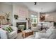 Open-concept living area featuring a fireplace, stylish decor, and seamless flow to the dining space at 1348 Peterson St., Myrtle Beach, SC 29577