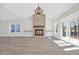 Sunlit living room with hardwood floors, fireplace, and access to patio at 4336 Parkland Dr., Myrtle Beach, SC 29579