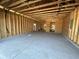 Unfinished two-car garage with high ceilings at 569 Beckham Ct., Murrells Inlet, SC 29576