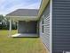 View of the home's gray exterior with a covered back porch and ceiling fan at 2275 King Farm Rd., Aynor, SC 29511