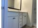 Bathroom features a white vanity with black hardware, a large mirror, and a walk-in shower at 2275 King Farm Rd., Aynor, SC 29511