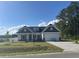 Exterior of home with a manicured front yard, garage and complementary landscaping at 2275 King Farm Rd., Aynor, SC 29511