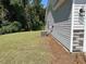 Exterior view of home shows the side of the house, the lawn and the AC unit at 2275 King Farm Rd., Aynor, SC 29511
