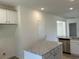 Kitchen island with granite countertops, complemented by white cabinets and stainless steel appliances at 2275 King Farm Rd., Aynor, SC 29511