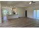 Open-concept living space with a kitchen island, stainless appliances, and bright light at 2275 King Farm Rd., Aynor, SC 29511