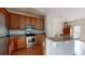 Kitchen boasts wood cabinets, granite counters and stainless steel appliances at 3565 Fountain Ln. # 3565, Myrtle Beach, SC 29577