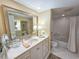 Bathroom featuring a spacious vanity, mirror, and walk-in shower at 9650 Shore Dr. # 1906, Myrtle Beach, SC 29572