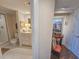 Connected bathroom featuring updated fixtures and a shower, adjacent to a decorated hallway area at 9650 Shore Dr. # 1906, Myrtle Beach, SC 29572