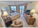 Bright bedroom with a ceiling fan, balcony access, and furnishings with a view at 9650 Shore Dr. # 1906, Myrtle Beach, SC 29572