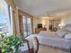 Bedroom featuring a balcony, ceiling fan, and a cozy sitting area with a desk at 9650 Shore Dr. # 1906, Myrtle Beach, SC 29572