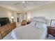 Bedroom featuring a ceiling fan and a dresser, with a comfortable chair at 9650 Shore Dr. # 1906, Myrtle Beach, SC 29572