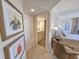 Hallway leading into the bathroom and bedroom with appealing decor at 9650 Shore Dr. # 1906, Myrtle Beach, SC 29572