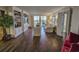 Inviting living room with hardwood floors, built-in shelving, and natural light from balcony access at 9650 Shore Dr. # 1906, Myrtle Beach, SC 29572