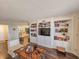 Bright living room with hardwood floors and a beautiful bookshelf at 9650 Shore Dr. # 1906, Myrtle Beach, SC 29572