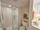 Modern shower with glass enclosure and updated fixtures, complemented by a convenient toilet area at 9650 Shore Dr. # 1906, Myrtle Beach, SC 29572