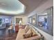 Bright sitting room with daybed, dresser, three mirrors, and hardwood flooring leading to other rooms at 9650 Shore Dr. # 1906, Myrtle Beach, SC 29572