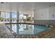 Relaxing indoor pool area with lounge chairs and ocean views at 161 Seawatch Dr. # 212, Myrtle Beach, SC 29572