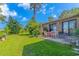 Well-maintained backyard with a patio, outdoor dining set, and a brick exterior home at 305 Resort Dr. # C12, Myrtle Beach, SC 29588