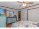 Bedroom with wood floors, a dresser with mirror, and a TV for relaxation at 305 Resort Dr. # C12, Myrtle Beach, SC 29588