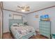 Comfortable bedroom featuring a blue bed frame, coordinated bedding, and a ceiling fan with lighting at 305 Resort Dr. # C12, Myrtle Beach, SC 29588