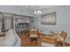 Inviting dining area with wooden table and chairs, adjacent to the kitchen, perfect for Gathering meals at 305 Resort Dr. # C12, Myrtle Beach, SC 29588