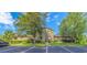 Inviting two-story condo with lush landscaping, exterior stairs and ample parking spaces at 305 Resort Dr. # C12, Myrtle Beach, SC 29588