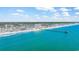 Breathtaking aerial view showcases the pristine beach and highlights the property's enviable proximity to the scenic pier at 404 32Nd Ave. N, North Myrtle Beach, SC 29582