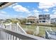 Scenic backyard view overlooking canal and neighboring waterfront homes at 404 32Nd Ave. N, North Myrtle Beach, SC 29582