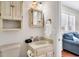 Bathroom with a white vanity and a white cabinet above the toilet at 404 32Nd Ave. N, North Myrtle Beach, SC 29582