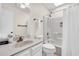 Full bathroom featuring a vanity with a sink, toilet, and shower-tub combo at 404 32Nd Ave. N, North Myrtle Beach, SC 29582