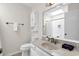 Bathroom featuring a vanity with a mirror, a toilet, and a shower-tub combo at 404 32Nd Ave. N, North Myrtle Beach, SC 29582