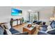 Cozy living room with coastal decor, shiplap walls, and access to an outdoor patio at 404 32Nd Ave. N, North Myrtle Beach, SC 29582