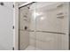 Modern walk-in shower with sleek sliding doors and a shower head at 404 32Nd Ave. N, North Myrtle Beach, SC 29582