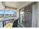 Relaxing balcony area with outdoor seating and sliding glass doors to the interior of the home at 6000 N Ocean Blvd. # 330, North Myrtle Beach, SC 29582