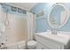 Charming bathroom featuring a shower-tub combo, vanity, and coastal decor at 6000 N Ocean Blvd. # 330, North Myrtle Beach, SC 29582