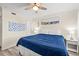 Cozy bedroom features a queen bed, a ceiling fan, and nautical decor at 6000 N Ocean Blvd. # 330, North Myrtle Beach, SC 29582