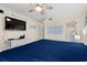Bedroom features a queen bed, television, and adjacent bathroom at 6000 N Ocean Blvd. # 330, North Myrtle Beach, SC 29582
