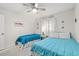 Inviting bedroom featuring two twin beds, a ceiling fan, and coastal decor at 6000 N Ocean Blvd. # 330, North Myrtle Beach, SC 29582