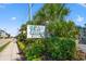 Sea Cabin Cherry Grove sign surrounded by lush landscaping at 6000 N Ocean Blvd. # 330, North Myrtle Beach, SC 29582