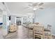 Open-concept living space with modern coastal decor and sliding door access to the outside at 6000 N Ocean Blvd. # 330, North Myrtle Beach, SC 29582