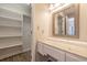 White vanity with a marble top and mirrored cabinet at 1437 Shoreline Dr., Myrtle Beach, SC 29577