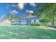 Brick house with a spacious lawn and mature trees at 1437 Shoreline Dr., Myrtle Beach, SC 29577