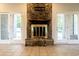 Stone fireplace with brass screen and wood mantle at 1437 Shoreline Dr., Myrtle Beach, SC 29577