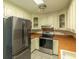Kitchen with stainless steel appliances and tile counters at 1437 Shoreline Dr., Myrtle Beach, SC 29577