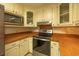 Kitchen with tile counters, stainless steel appliances and white cabinets at 1437 Shoreline Dr., Myrtle Beach, SC 29577