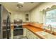 Kitchen with stainless steel appliances and tile counters at 1437 Shoreline Dr., Myrtle Beach, SC 29577