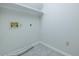Laundry room with tile floor and built-in shelving at 1437 Shoreline Dr., Myrtle Beach, SC 29577