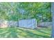 White storage shed in a backyard setting at 1437 Shoreline Dr., Myrtle Beach, SC 29577