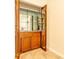 Built-in wet bar with mirrored doors and glass shelving at 1437 Shoreline Dr., Myrtle Beach, SC 29577